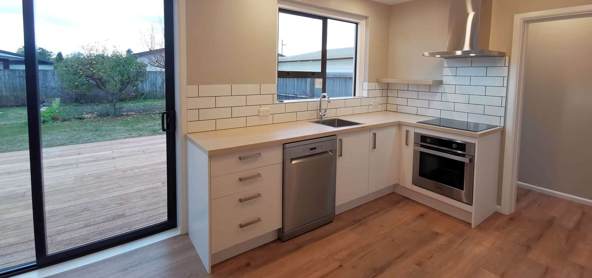 Spacious kitchen with contemporary design and open window