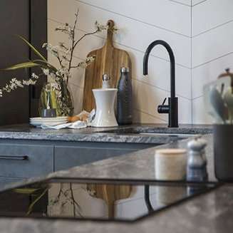 Black marble kitchen top with utensils