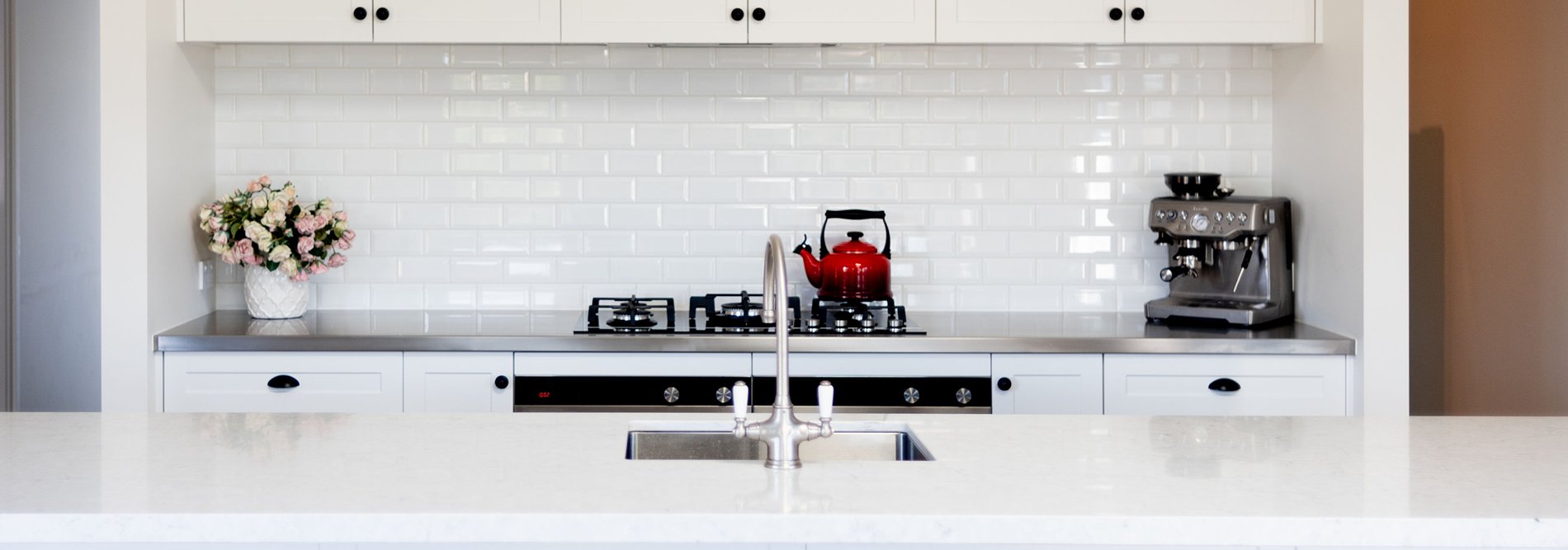 White kitchen design with kitchen appliances