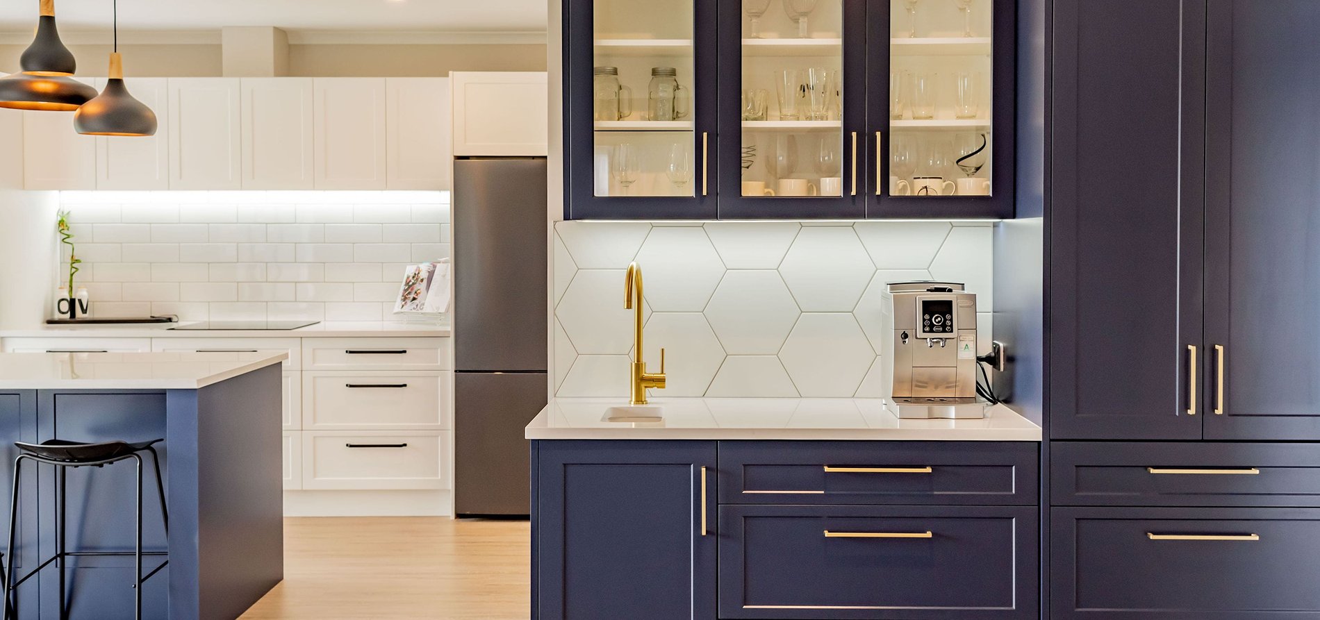 Custom aesthetic kitchen featuring a unique tile backsplash and high-end appliances