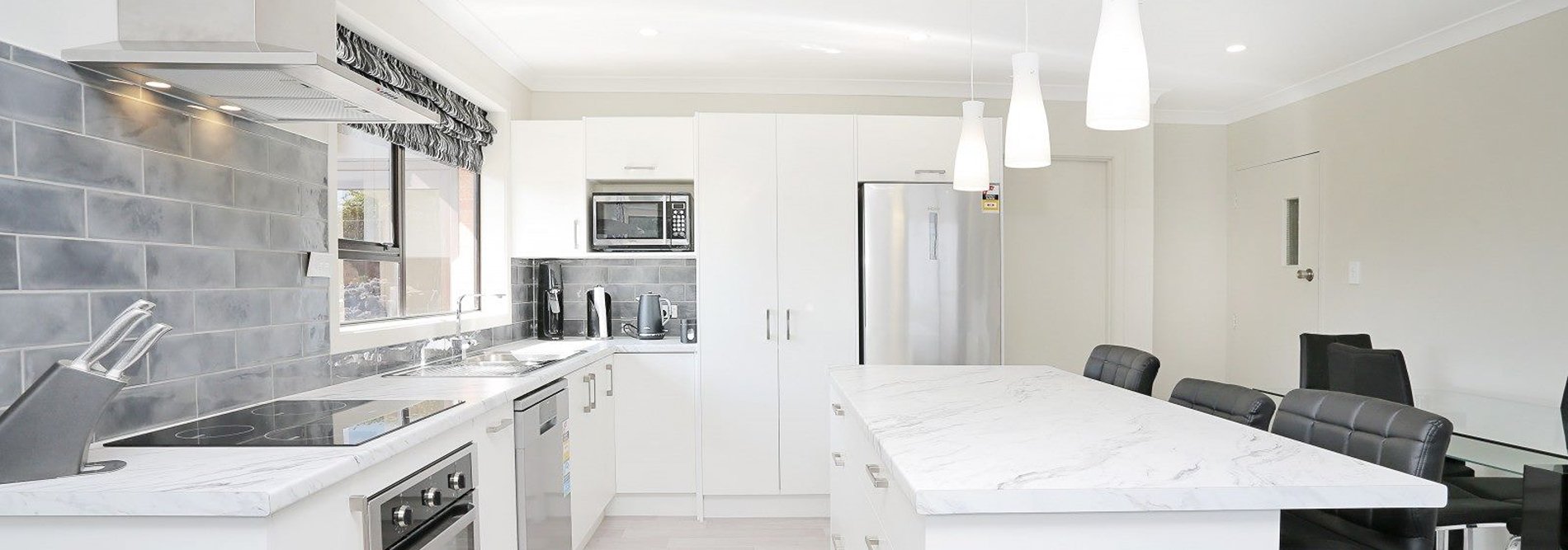 White kitchen with rolled edge laminate benchtop