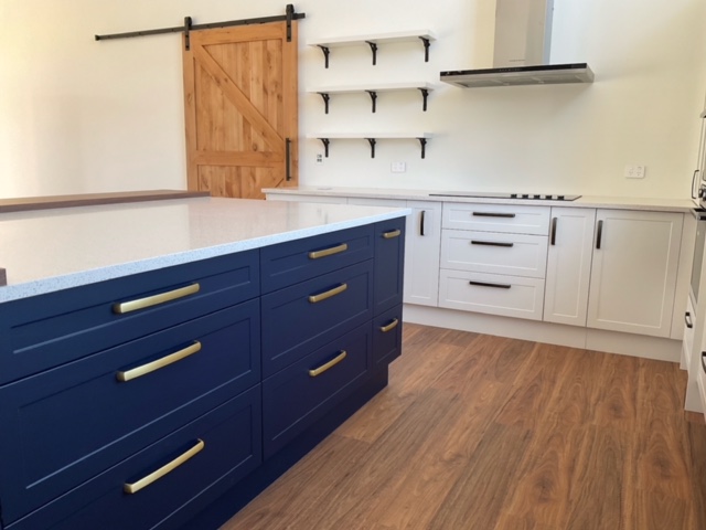 blue and white kitchen with shaker style doors
